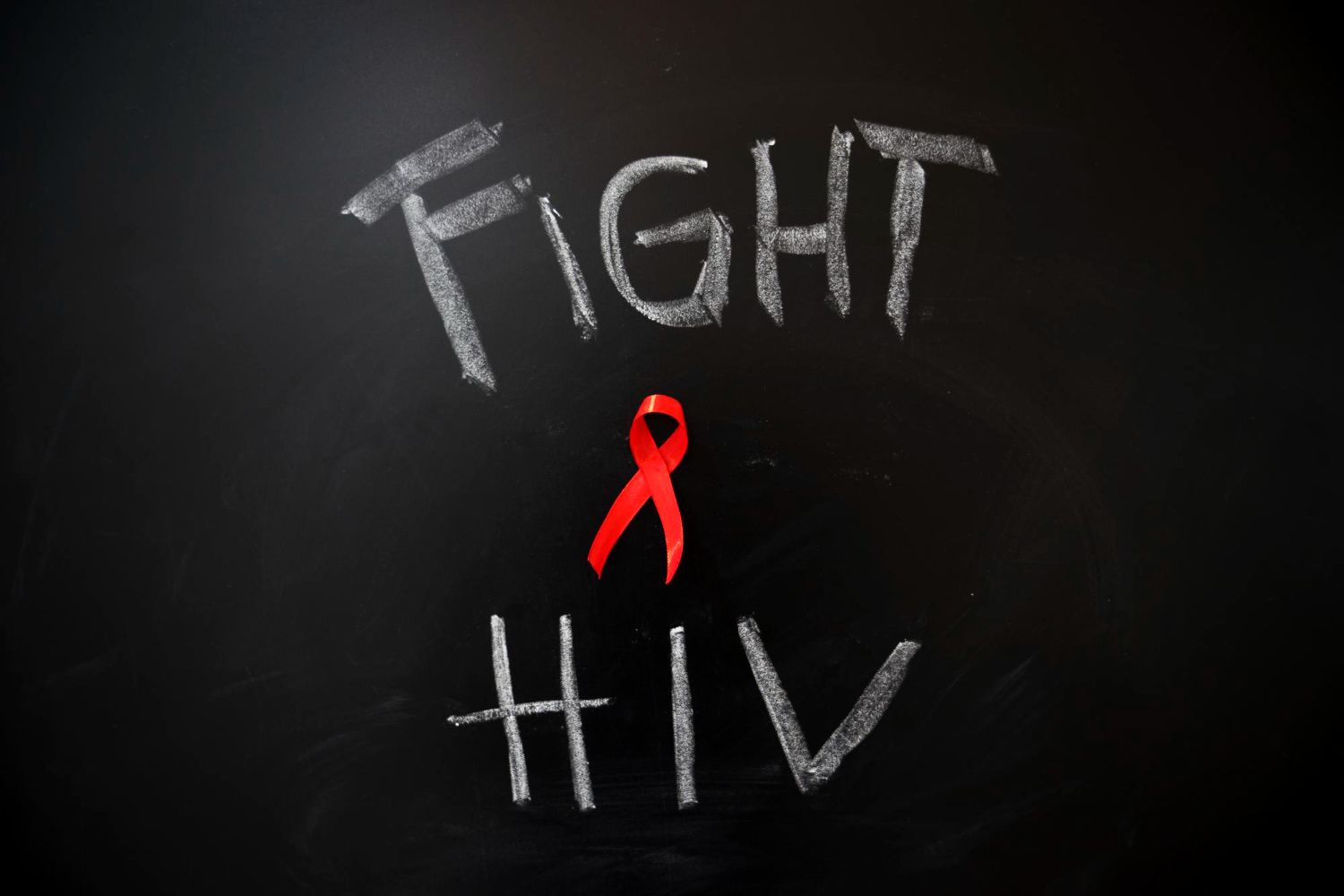 chalkboard reading fight hiv with red ribbon zero hiv stigma day arnot health